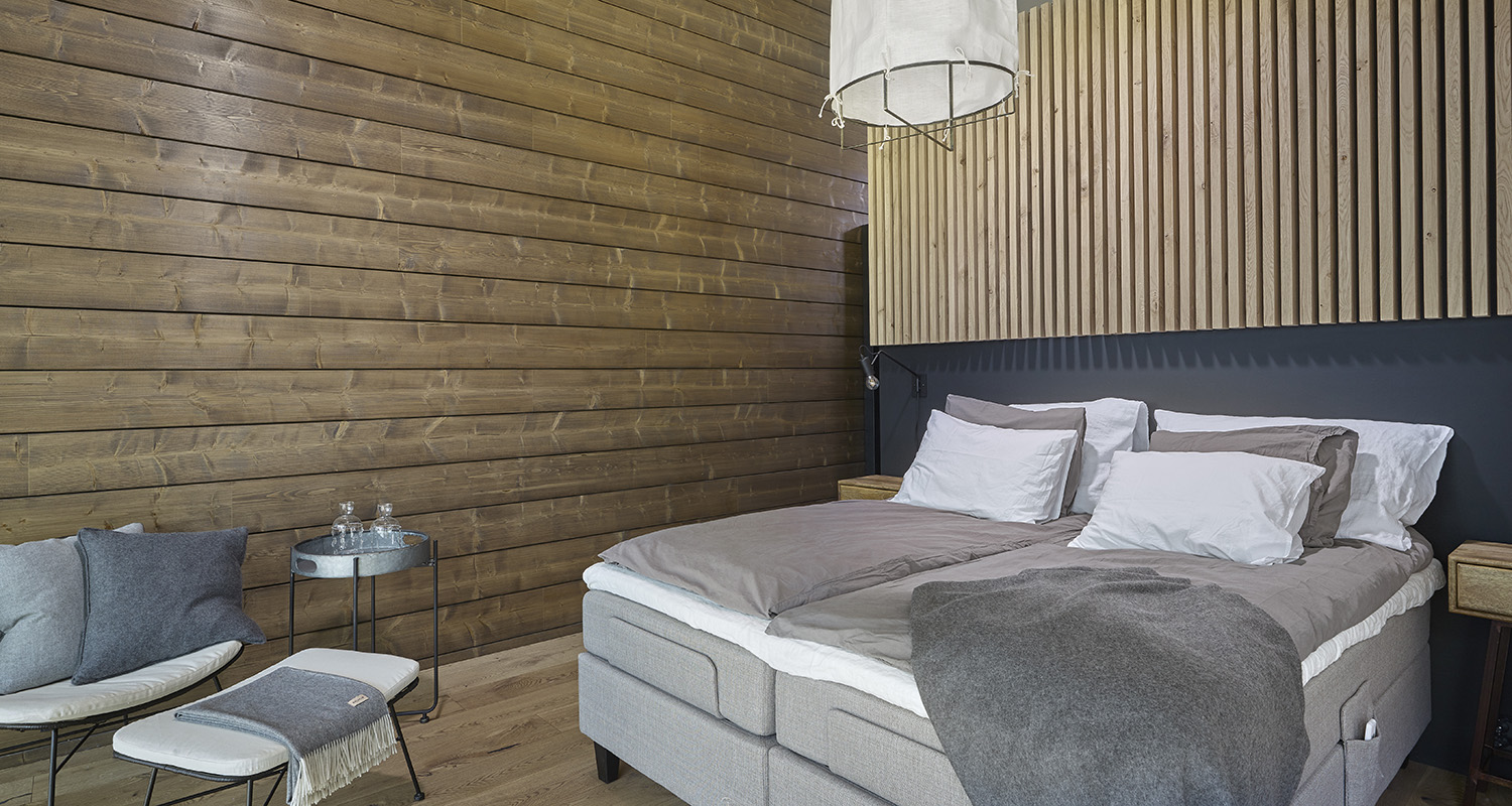 Wave – individuell Massivblockhaus in Finnland – Schlafzimmer Wave – individuell Massivholzhaus in Finnland – Schlafzimmer